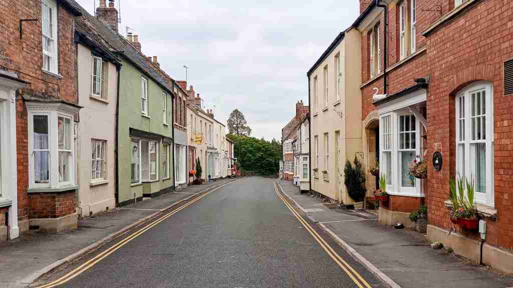 Berkeley Church Lane with historic buildings near church and castle. Church Lane in Berkeley leading from St Mary’s church towards Berkeley Castle, lined with historic buildings such as The Chantry, Dr Jenner’s house