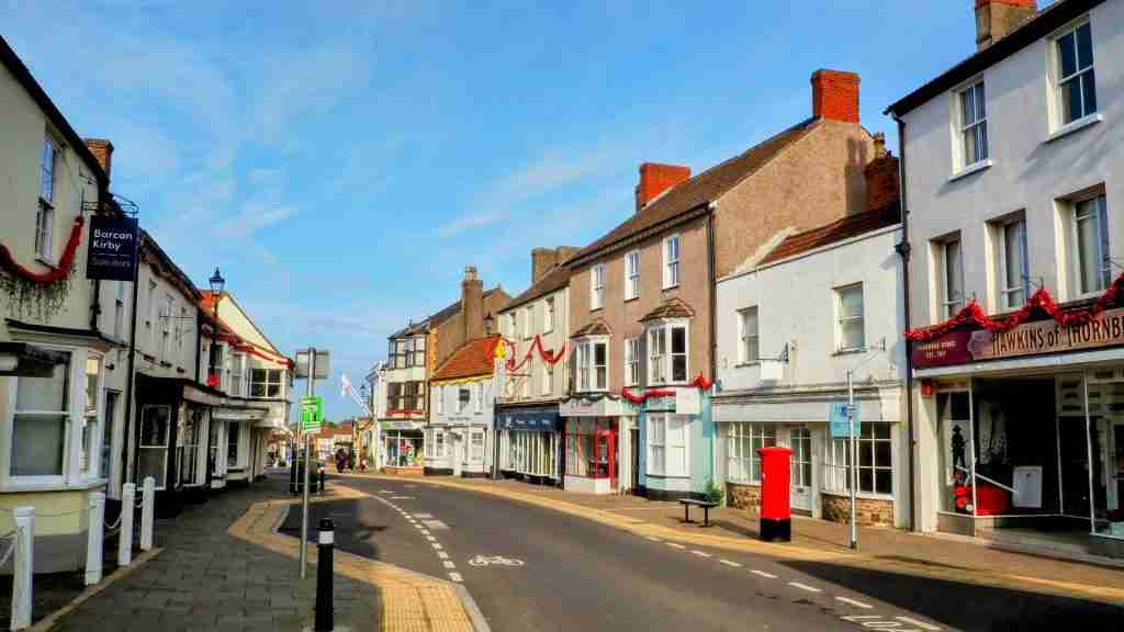 Thornbury High Street with shops Thornbury High Street featuring a mix of traditional shops and high‑street brands