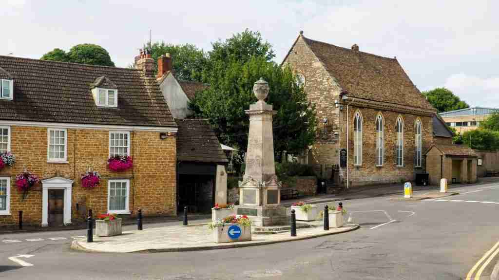Wotton‑under‑Edge war memorial – Portland‑stone column. Square Portland‑stone war memorial in Wotton‑under‑Edge at the town crossroads.